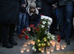 People Light Candles In Vigil For Russian Metro Blast Victims