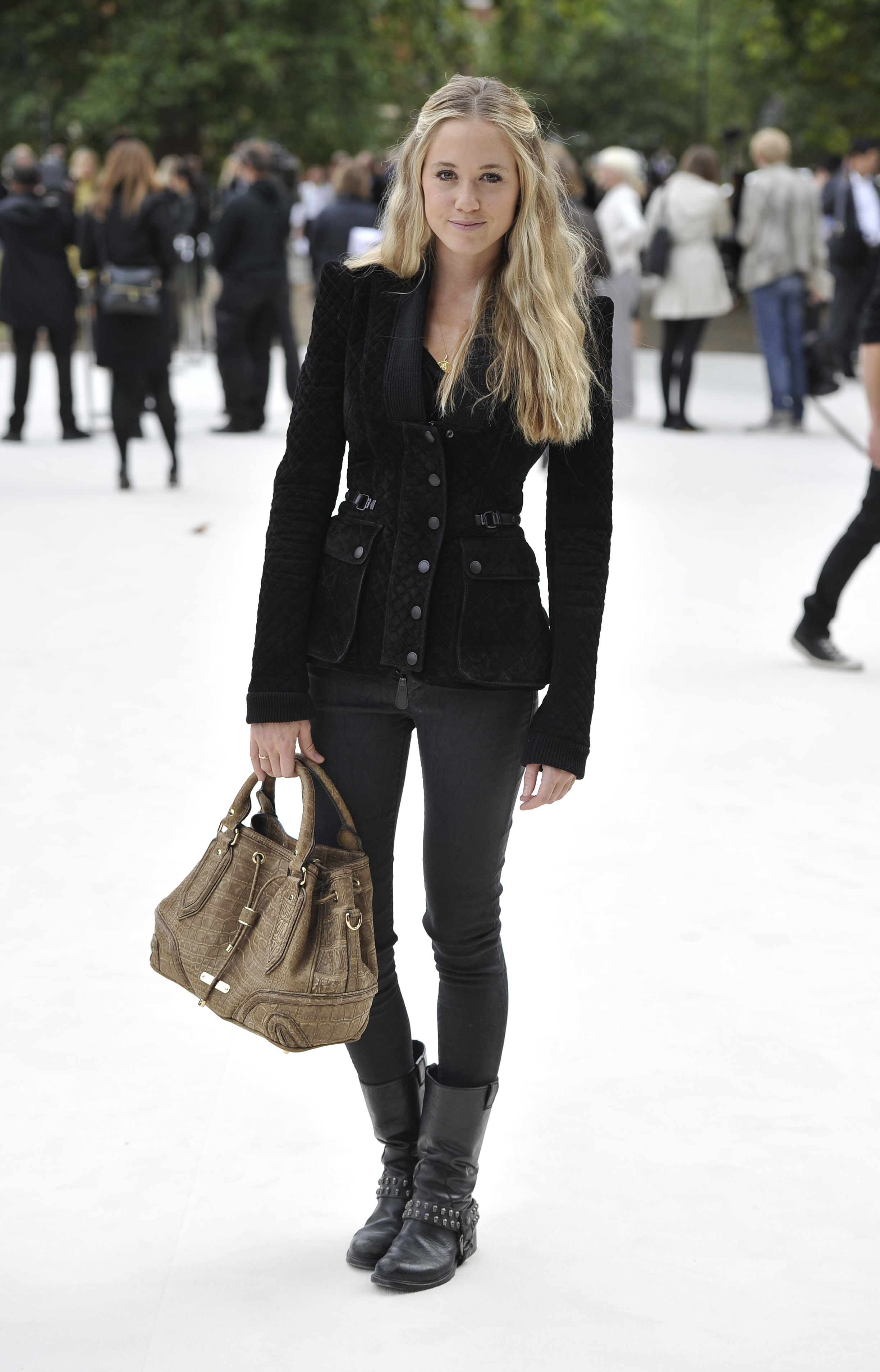 arrives at the Burberry Spring Summer 2013 Womenswear Show at Kensington Gardens on September 17, 2012 in London, England.