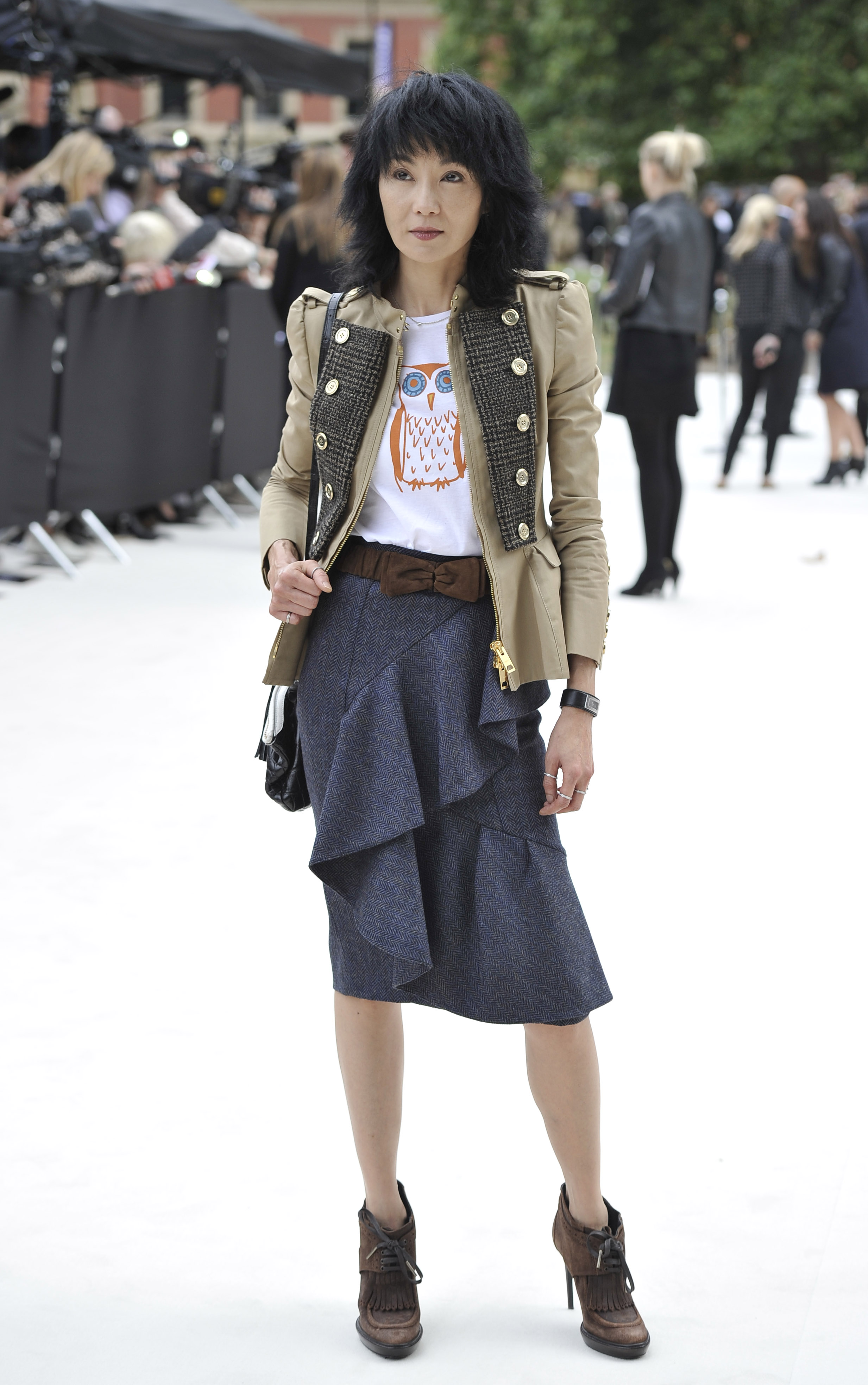 arrives at the Burberry Spring Summer 2013 Womenswear Show at Kensington Gardens on September 17, 2012 in London, England.