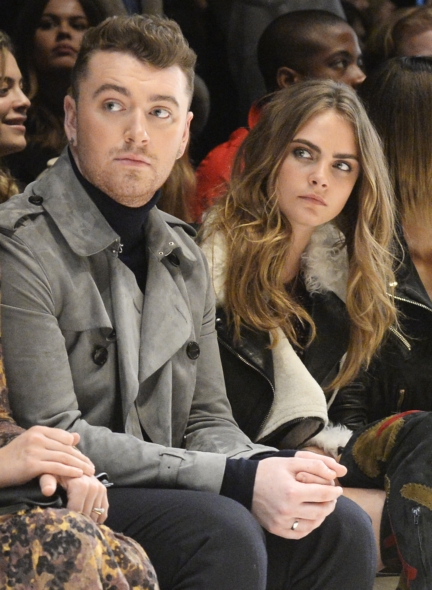 sam-smith-and-cara-delevingne-wearing-burberry-at-the-burberry-womenswear-autumn_winter-2015-show